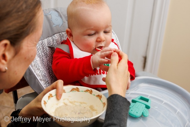 A baby's first time eating solid food