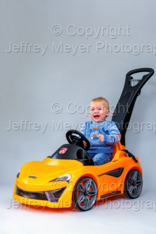 My baby boy behind his McLaren 570S